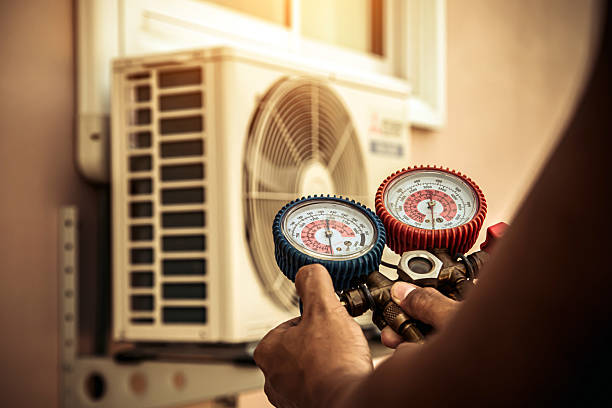 Professional Air Conditioning Service technician working in Montgomery, PA